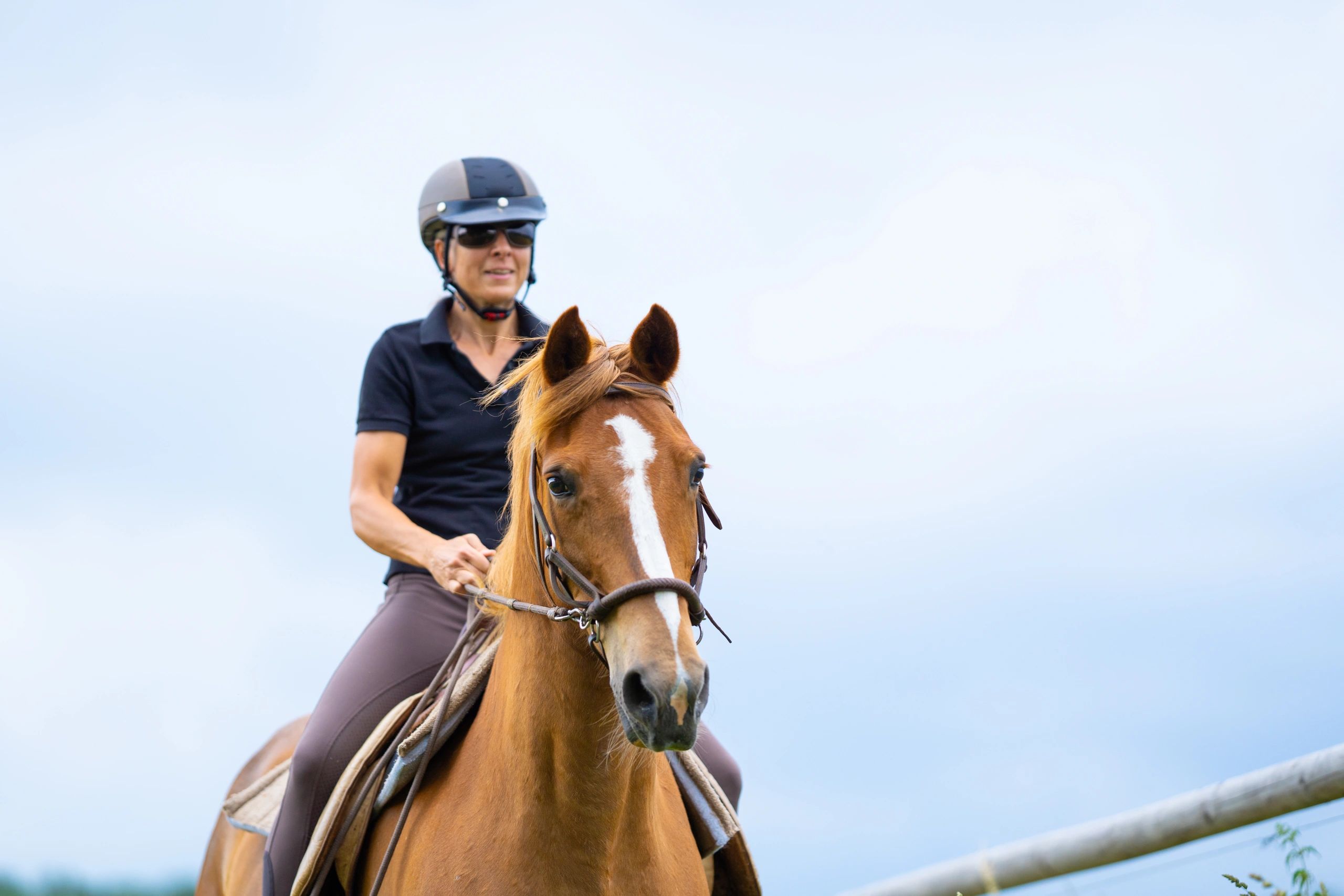 Female rider on horseback outdoors