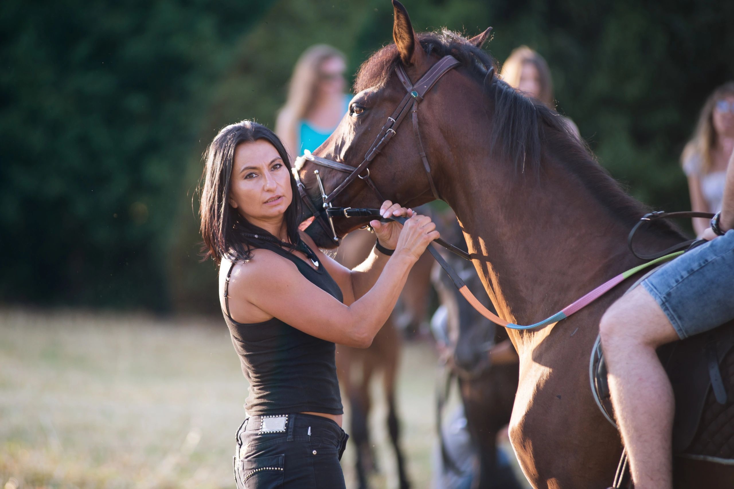 Horse owner standing with horse for testimonial portrait